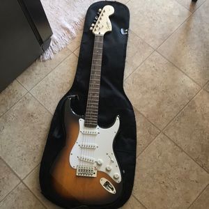 Fender squire strat electric guitar w/ amplifier